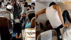 Uçakta panik: Havadayken uçak camını tekmelemeye başladı